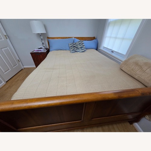 Used Light Brown Wood Queen Bed for sale on AptDeco