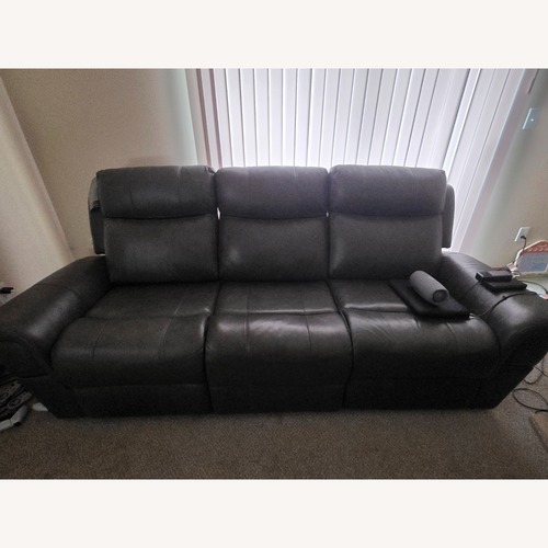 Used Ashley Furniture Dark Gray Leather Recliner Sofa for sale on AptDeco