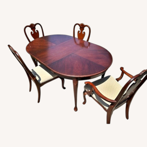 Used Dark Brown Wood Dining Set with 4 Chairs for sale on AptDeco