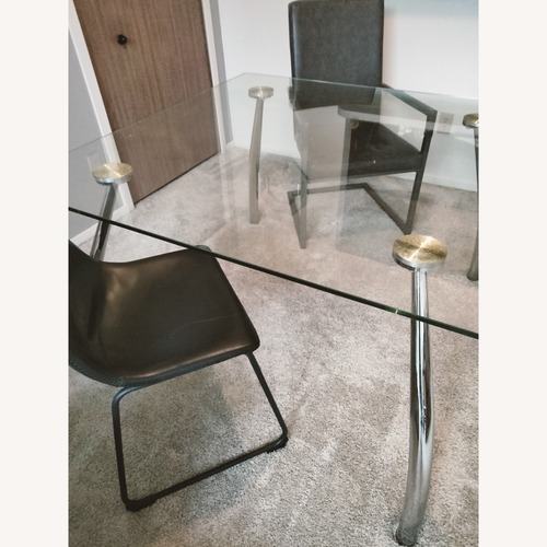 Used Glass Table Silver Chrome Legs With 2 Chairs for sale on AptDeco