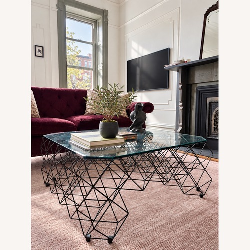 Used From The Source Glass Coffee Table with sculptural base for sale on AptDeco