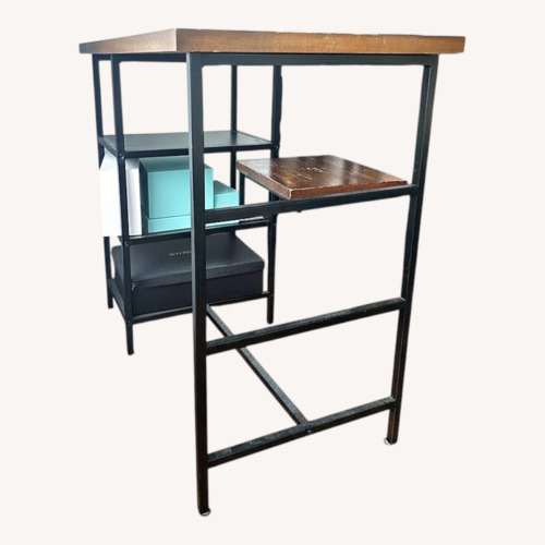 Used Dark Brown Wood Dining Table for sale on AptDeco