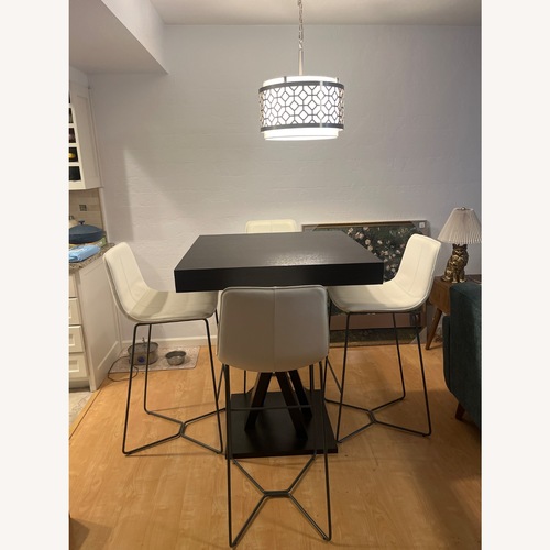 Used High Top Table with Four Leather Chairs for sale on AptDeco