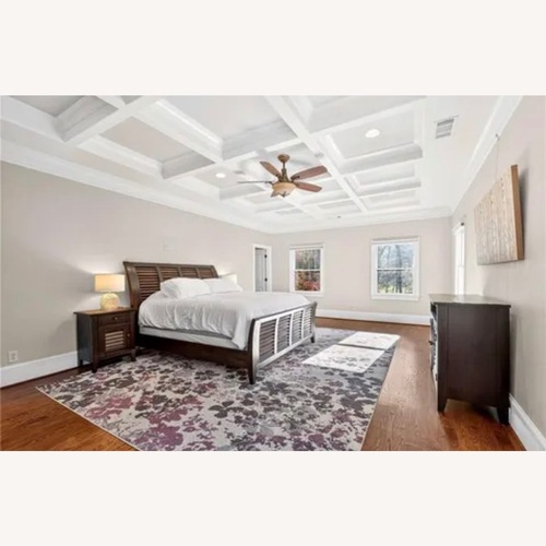 Used Dark Brown Wood King Bed  for sale on AptDeco