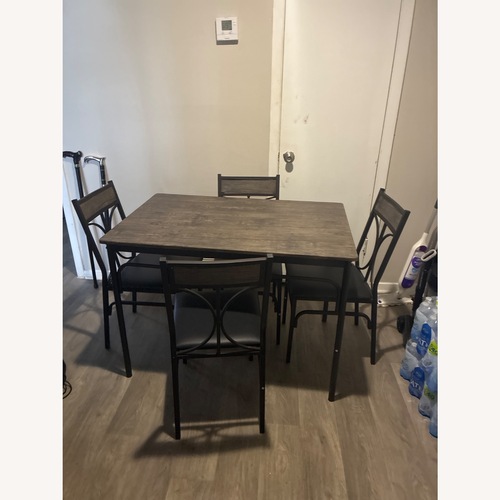 Used Grey Wood Dinner Table with 4 Chairs for sale on AptDeco