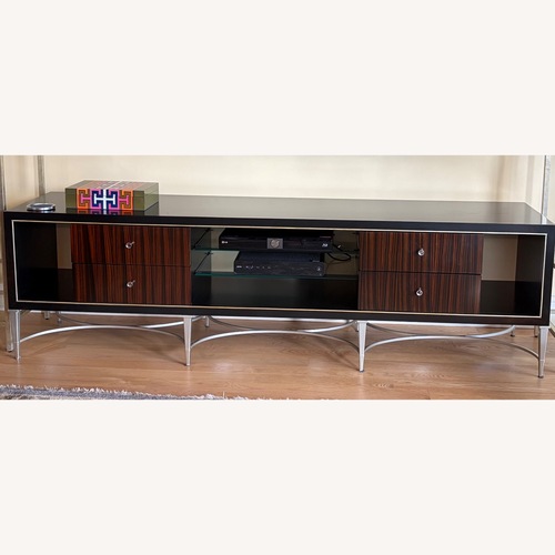 Used Caracole Media Console Black Wood Champagne Legs for sale on AptDeco