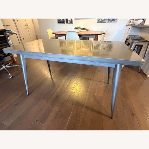 Used Tolix Raw Varnished Stainless Steel Dining Table for sale on AptDeco