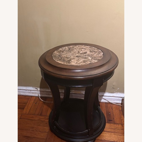 Used Round Wooden End/Side Table w/Faux Marble Top for sale on AptDeco