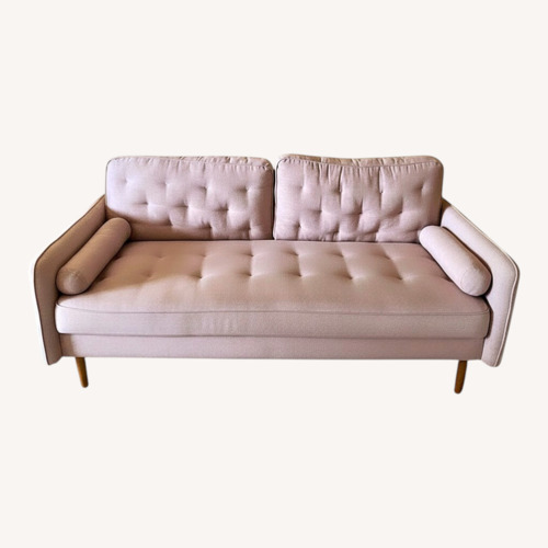 Used Mid Century Style Soft Pink Couch for sale on AptDeco