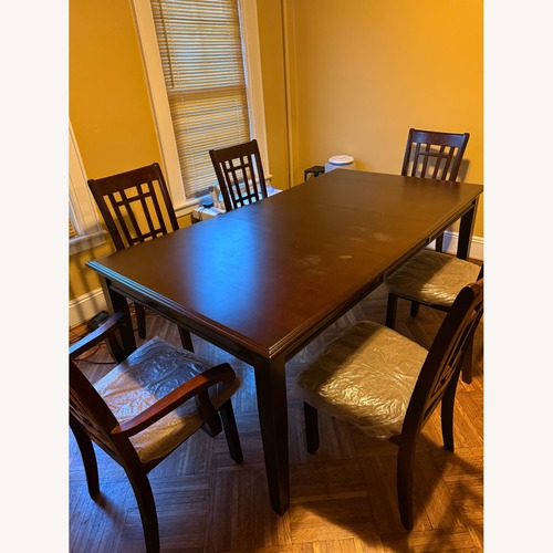 Used Dark Brown Wood Dining Tables for sale on AptDeco