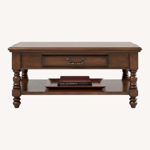 Used Ashley Furniture Dark Brown Wood Coffee Table for sale on AptDeco