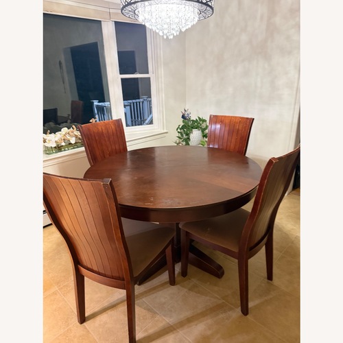 Used Dark Brown Wood Dining Set for sale on AptDeco