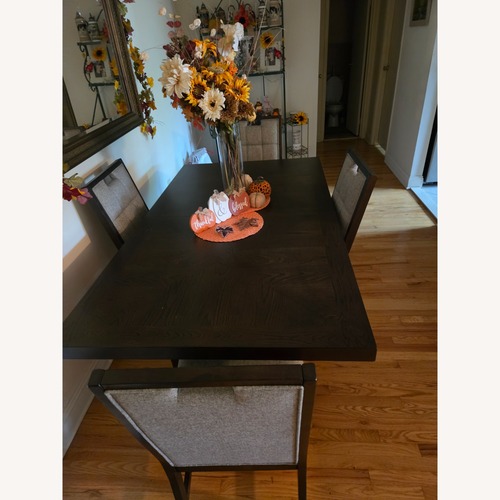 Used Dark Brown Wood Dining Set for sale on AptDeco