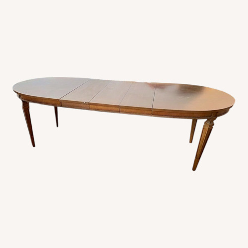 Used Light Brown Wood Dining Table Oval for sale on AptDeco