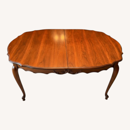 Used Dark Brown Dining Table for sale on AptDeco