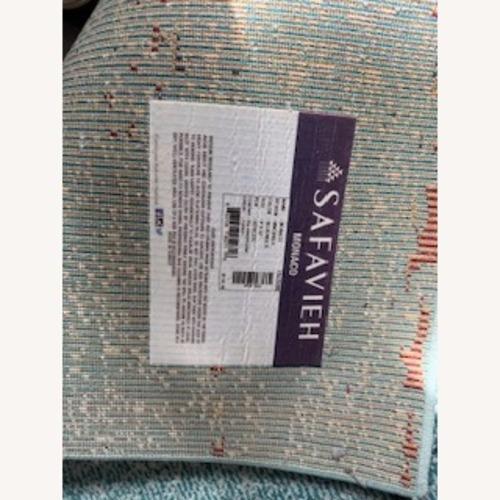 Used Safavieh Monaco Blue Resin Area Rug 9' x 12' for sale on AptDeco