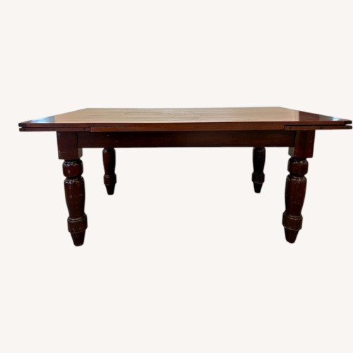 Used Dark Brown/ Red Wood Extension Dining Table for sale on AptDeco