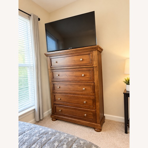 Used Ashley Furniture Light Brown Wood Chest for sale on AptDeco