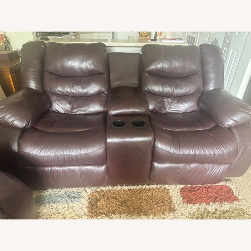 Used Ashley Furniture Dark Brown Leather Loveseat for sale on AptDeco
