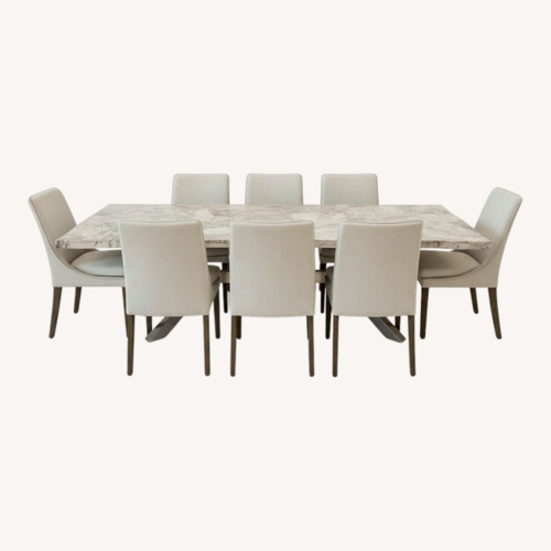Used Arhaus Natural Stone Table With 8 Chairs for sale on AptDeco