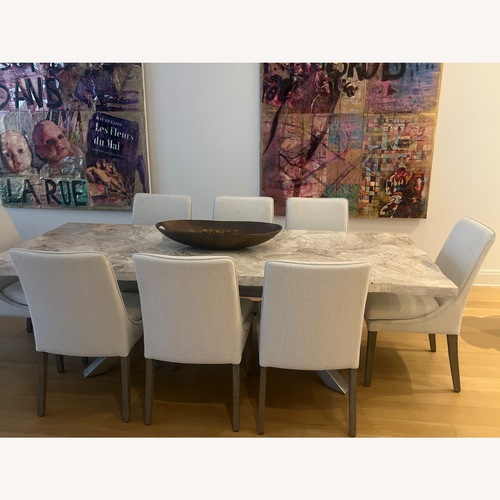 Used Arhaus Natural Stone Table With 8 Chairs for sale on AptDeco