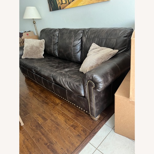 Used Ashley Furniture Dark Brown Sleeper Sofa for sale on AptDeco