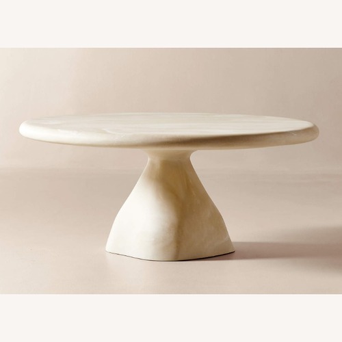 Used CB2 Espira 35" Round Cream Marbled Resin Coffee Table for sale on AptDeco
