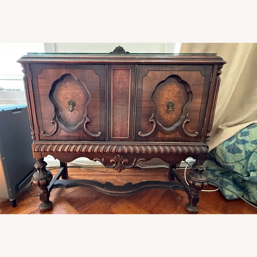 Used Vintage/Antique Finds Dark Brown Wood Armoire for sale on AptDeco