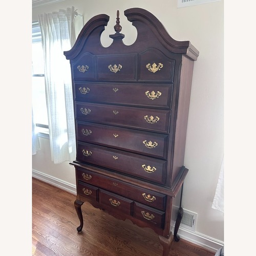 Used Vintage/Antique Dark Brown Wood Armoire for sale on AptDeco