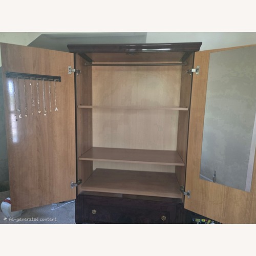 Used Vintage/Antique Finds Dark Brown Wood Armoire for sale on AptDeco