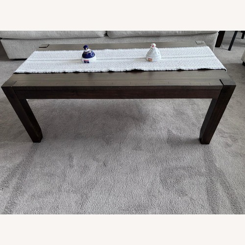 Used Dark Brown Wood Coffee Table for sale on AptDeco