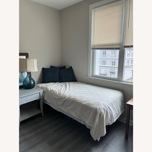 Used White Fabric Twin Bed for sale on AptDeco