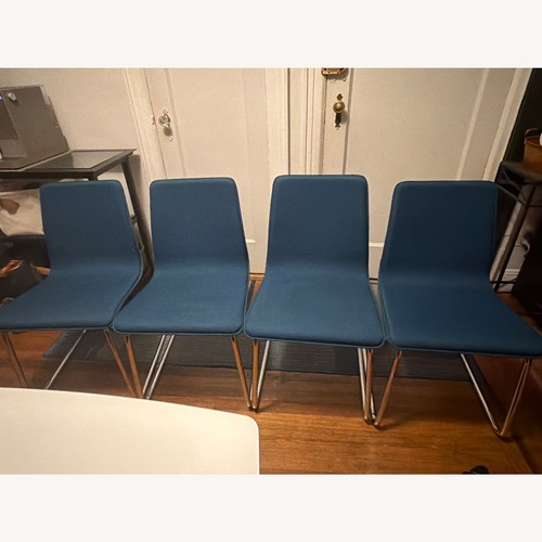 Used 4 CB2 Blue Fabric Cantilever Dining Chairs for sale on AptDeco