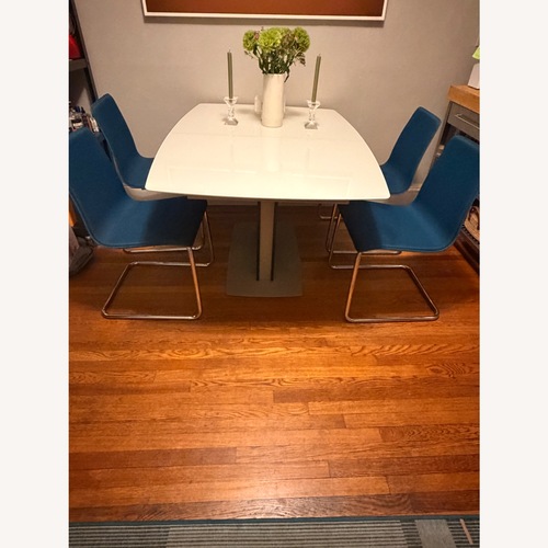 Used 4 CB2 Blue Fabric Cantilever Dining Chairs for sale on AptDeco