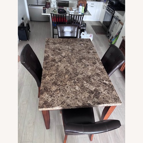 Used Faux Marble Dining Table Set with 4 Chairs for sale on AptDeco