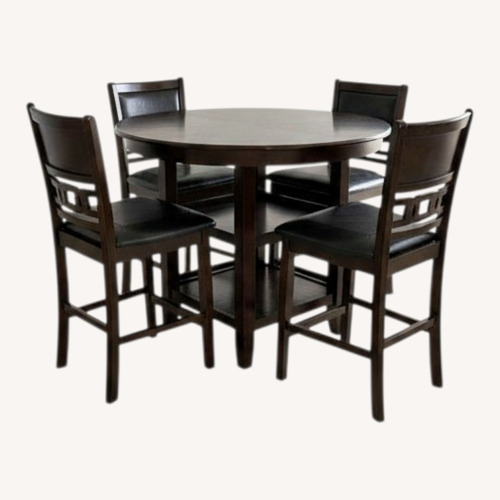 Used Round Wood Dining Table With Chairs for sale on AptDeco