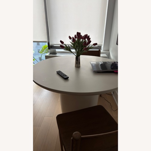 Used CB2 Lola 45" Round Ivory Concrete Dining Table for sale on AptDeco