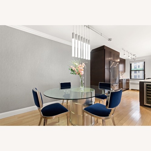 Used Custom Upholstered Sunpan Blue Metal Dining Chair for sale on AptDeco