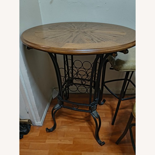 Used Dark Brown Metal Dining Set for sale on AptDeco