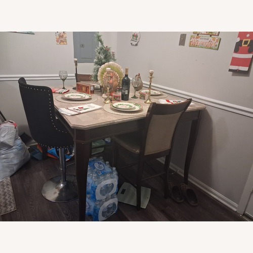 Used Dark Brown Wood Dining Table for sale on AptDeco