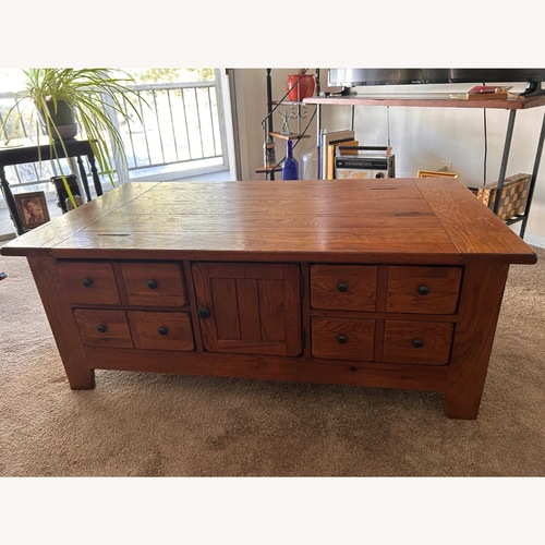 Used Rustic Brown Oak Apothecary Coffee Table for sale on AptDeco