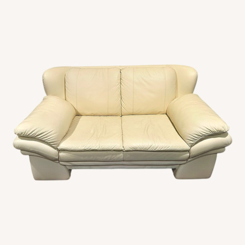 Used Cream 100% Leather Sofa and Loveseat for sale on AptDeco