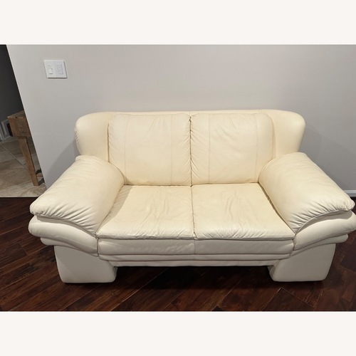 Used Cream 100% Leather Sofa and Loveseat for sale on AptDeco