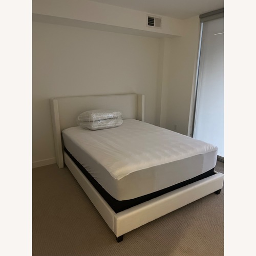 Used Pottery Barn Elliott Ivory Fabric Queen Bed for sale on AptDeco