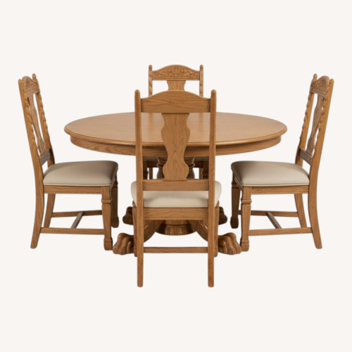 Used Round Oak Table With Carved Base and Six Chairs for sale on AptDeco