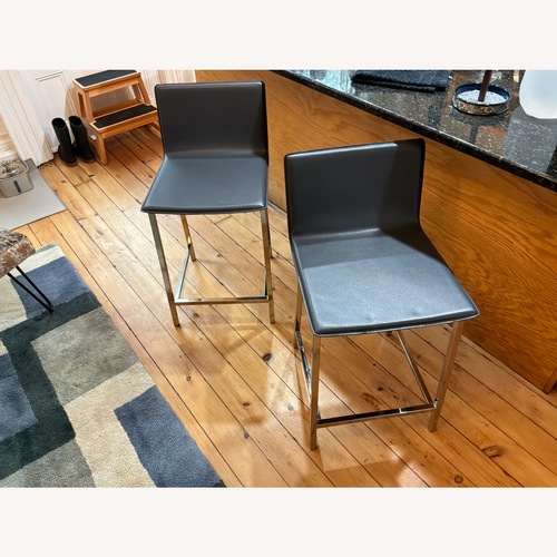 Used Pair of CB2 Phoenix Black Leather Stools for sale on AptDeco