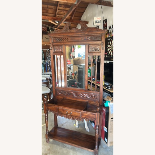 Used Carved Wood Hall Tree with Mirror and Drawer for sale on AptDeco