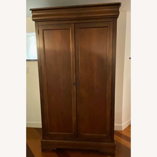 Used Vintage Dark Brown Wood Armoire by Thomasville for sale on AptDeco