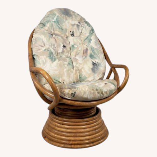 Used Vintage Rattan Swivel Rocker with Floral Cushions for sale on AptDeco