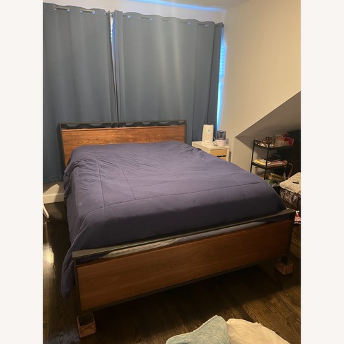 Used Crate & Barrel Bowery Dark Brown Wood Queen Bed for sale on AptDeco